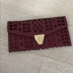 Burgundy clutch and purse with gold details